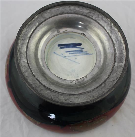A William Moorcroft Eventide pattern pewter footed bowl, c.1925, diam. 18.5cm, rim repaired